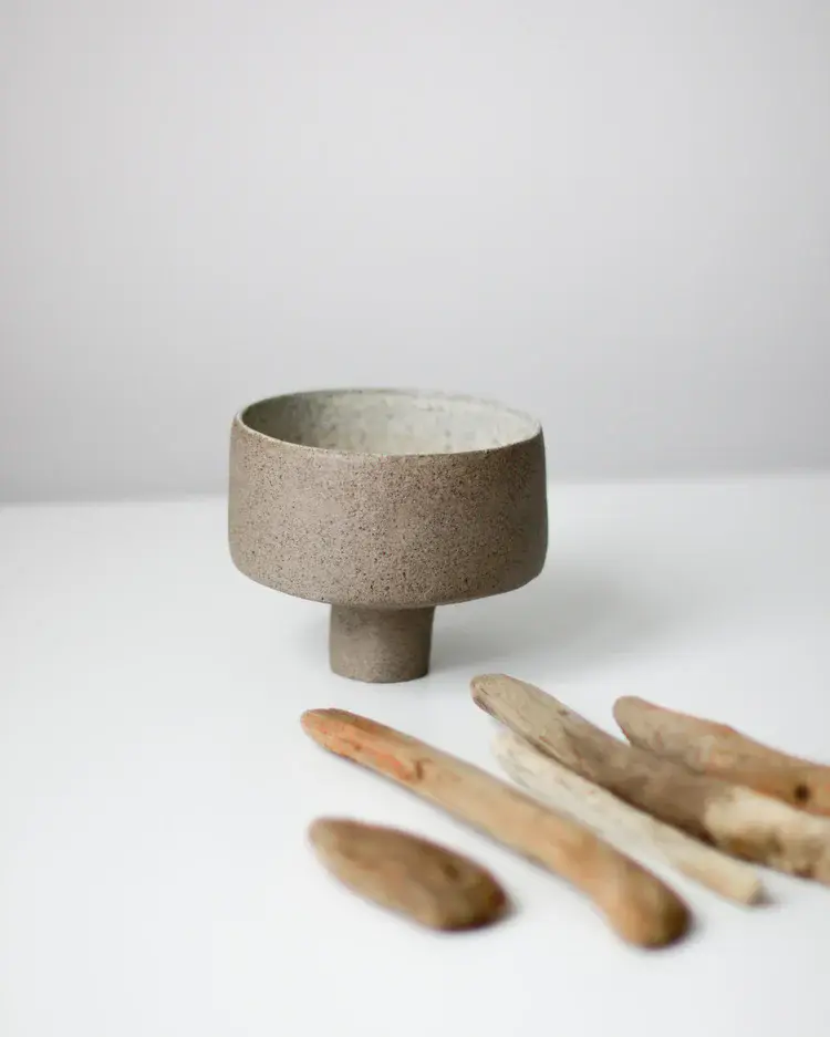 Rustic hand-built stoneware bowl in earthy glaze