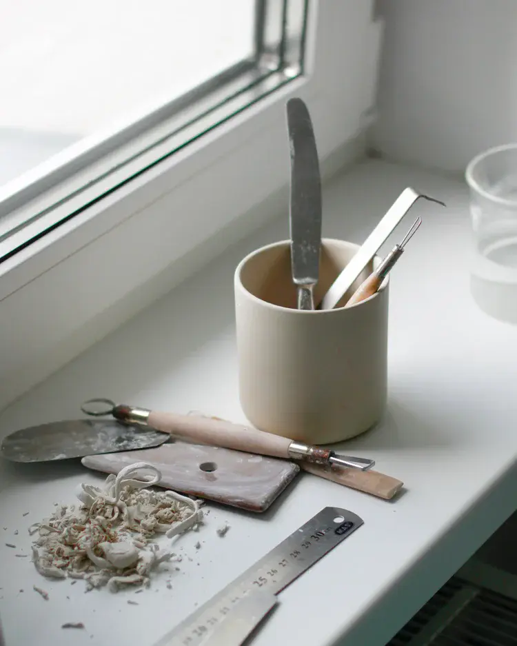 Inside the pottery studio with shelves of ceramics