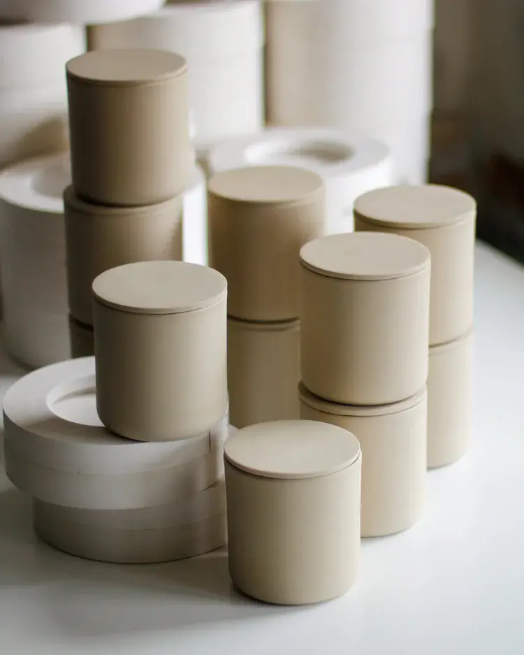 Slip-cast lidded jar with warm terracotta glaze