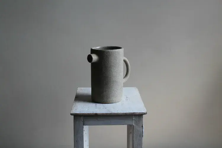 Stoneware plates stacked showing irregular edges