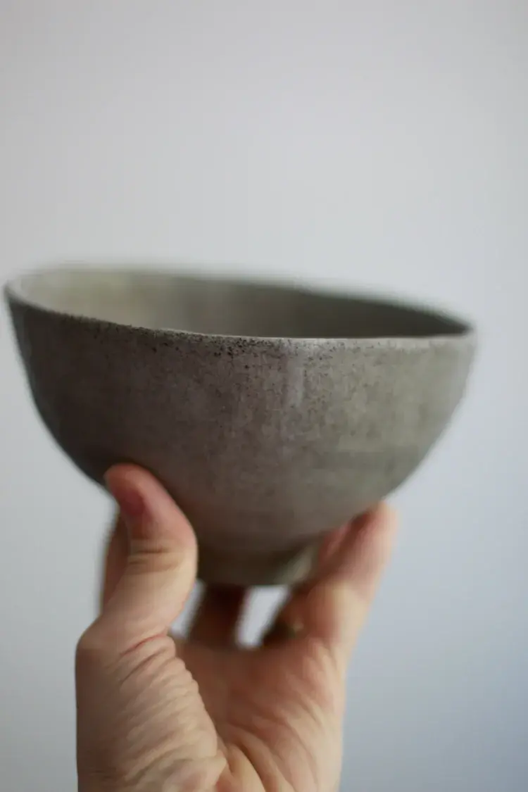 Sculptural stoneware vase with organic flowing form